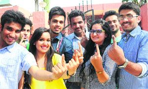 First-time voters outside a polling booth in Chandigarh.