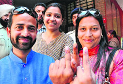 BSP candidate Jannat Jahan with her husband Hafiz Anwar-ul-Haq at a polling centre.