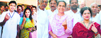 State Congress chief Ashok Tanwar and his wife Avantika Maken Tanwar after casting their votes in Sirsa, (and right) 