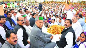CM Virbhadra Singh and Industry Minister Mukesh Agnihotri at an election meeting at Tahliwal village in Una on Thursday.