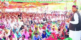 Former CM PK Dhumal addresses a public meeting at Dharampur on Thursday.