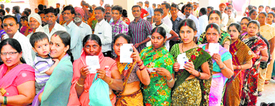 Residents queue up at a polling station at Hallo Majra in Chandigarh on Thursday. Tribune photo: Parvesh Chauhan
