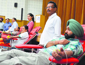 Volunteers donate blood at camp at the DMCH in Ludhiana on Thursday.  