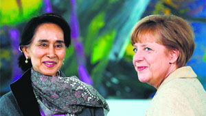 Myanmar pro-democracy leader Aung San Suu Kyi is greeted by German chancellor Angela Merkel at the Chancellory in Berlin on Thursday.
