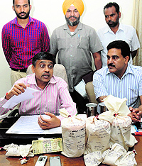 IG Jatinder Jain and AIG Ajay Maluja address mediapersons during a press conference after seizing heroin in Bathinda on Friday