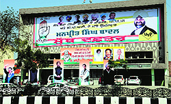 The changed flex posters outside the main gate of the Congress-PPP joint candidate for the Bathinda Lok Sabha constituency, Manpreet Singh Badal, in Bathinda on Friday