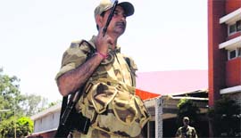CISF personnel stand guard outside the EVM collection centre in Sector 26, Chandigarh.