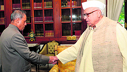 Governor Aziz Qureshi shakes hands with President Pranab Mukherjee at Rashtrapati Bhavan in New Delhi on Friday
