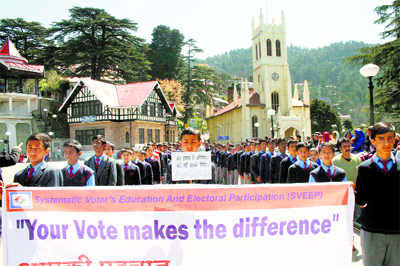 Students from different schools participate in  voters awareness rally organised by the District Election Office in Shimla on Friday.
