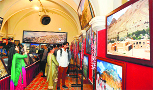 People during the photo exhibition at Gaiety Theatre in Shimla on Friday.