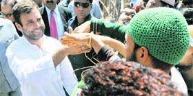 Congress vice-president Rahul Gandhi shakes hands with supporters after addressing a public meeting in Doda on Friday.
