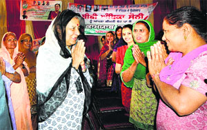 The Congress candidate for the Anandpur Sahib parliamentary constituency, Ambika Soni, interacts with women during an election campaign in Kansal village on Saturday.