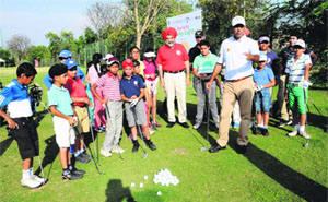 Ace golfer Jeev Milkha Singh gives tips to young players during Beat the pro, a charity event, held at the CGA Golf Range in Chandigarh on Saturday.