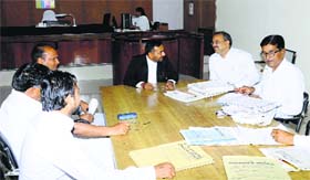 Additional District and Sessions Judge Sandeep Singh settles cases during National Lok Adalat in Sirsa on Saturday.