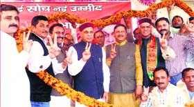 Former CM PK Dhumal being welcomed at an election rally at Shillai in Sirmaur on Saturday.