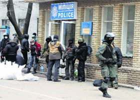 Armed pro-Russian activists carrying riot shields occupy the police station in the eastern Ukraine town of Slaviansk on Saturday