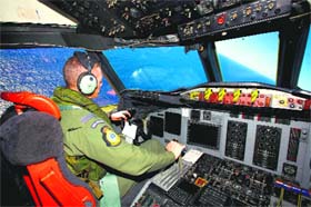 A search aircraft as it flies over the southern Indian Ocean