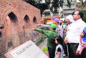Revisiting History: Visitors gather near the Flame of Liberty memorial on the 95th anniversary of Jallianwala Bagh massacre