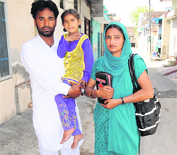 Taranjit Singh and his wife Kiranjit Kaur along with their daughter in Bathinda on Sunday.