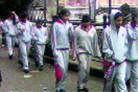 Students from Delhi enjoy showers and cool weather in Mussoorie on Sunday.