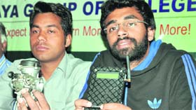 Himanshu and Vijay Singh show the anti-accident device during a press conference in Dehradun on Sunday.