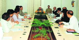 Governor Aziz Qureshi chairs a meeting in Dehradun on Sunday.