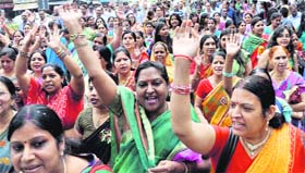 Women take out Shobha Yatra in Dehradun on Sunday.