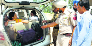 Policemen check a vehicle in view of the Lok Sabha poll, in Rajpura on Sunday.