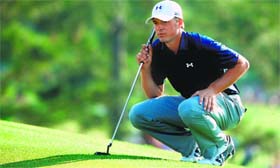 Jordan Spieth lines up a putt on the 17th green during the third round of the Masters Tournament in Augusta on Saturday.
