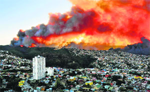 A view of houses in flames during a fire in Valparaiso, Chile.