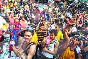 Revellers enjoy foam as they take part in a water fight during Songkran Festival celebrations at Khaosan road in Bangkok. Also known as the water festival, it marks the start of Thailand's traditional New Year.