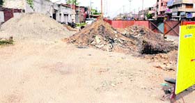 Construction material for the Metro Bus Project lies on the Batala road in Amritsar