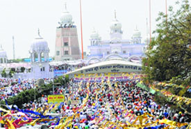 Devotees throng Gurdwara Takht Damdama Sahib on the occasion of Baisakhi in Bathinda on Monday.