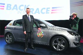 Back in the race: Carlos Tavares, CEO of French carmaker PSA Peugeot Citroen, poses after a news conference to present the group's strategic plan "Back in the Race" at PSA headquarters in Paris on Monday