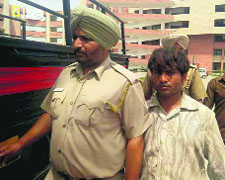 The accused in police custody.