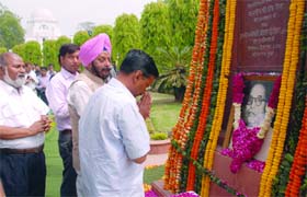 Former Chief Minister Arvind Kejriwal and Vidhan Sabha Speaker(L) MS Dhir pay their tributes to Dr. Bhim Rao Ambedkar on his birth anniversary at Old Delhi Secretariat on Monday