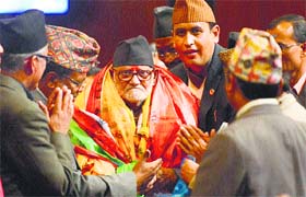 Sushil Koirala (centre) is congratulated by his supporters on his election as Nepal's Prime Minister in Kathmandu on February 10, 2014.