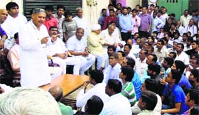 BJP candidate from Gurgaon Rao Inderjit Singh addresses a gathering after communal tension at Punhana village in Mewat on Monday.
