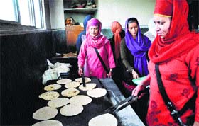 Devotees at a community kitchen at a gurdwara in Shimla on Baisakhi on Monday.
