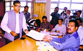Lokhit Party candidate Prem Chand Vishwakarma files his nomination in Dharamsala on Monday.