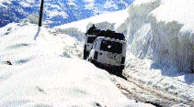 Vehicles move slowly on Manali-Leh highway.
