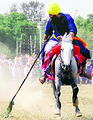 Nihangs display their skills on the concluding day of the Baisakhi Mela at Talwandi Sabo on Tuesday