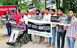 Members of ArriveSAFE, an NGO, hold a silent protest outside the Sector 34 police station in Chandigarh on Tuesday