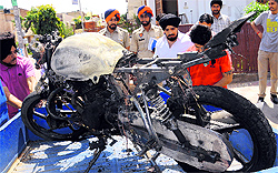 Youths had a miraculous escape when the motorcycle they were riding on caught fire at Phase IV in Mohali on Tuesday