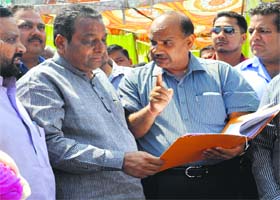 Court Commissioner and special officer for encroachment Rajeev Sharma discusses details with Mayor Vinod Chamoli in Dehradun on Monday
