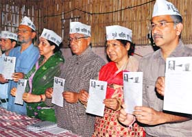 COMMAN MANS PROMISE: AAP candidate Anoop Nautiyal and other party members release the party's manifesto for LS elections in Dehradun on Tuesday
