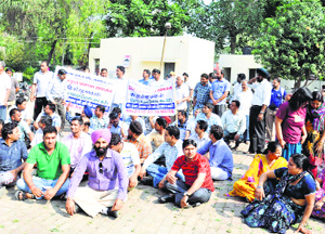 Parents stage a dharna at the Deputy Commissioners residence in Karnal on Tuesday. 