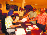 AAP workers submit a memorandum to Commissioner of Police AS Chawla, seeking a probe into the third-degree torture of two Dalit brothers at a village in Faridabad district, on Tuesday.