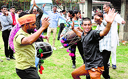 Supporters of a candidate dance during a campaign rally on the last day of the campaigning for the Udhampur-Doda parliamentary seat in Udhampur on Tuesday