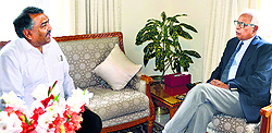 Governor NN Vohra with Lokesh Dutt Jha, J&K's Principal Resident Commissioner at New Delhi, at Raj Bhawan in Jammu on Tuesday